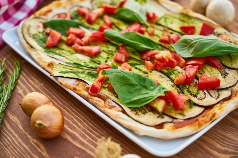 Vegetarian Detroit-style garden pizza with fresh vegetables