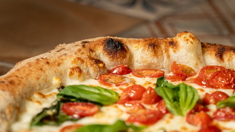 Classic Margherita Detroit pizza with fresh tomato and basil