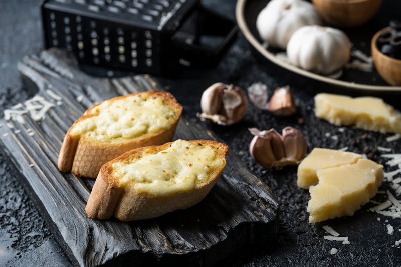 Garlic knots with herb butter and parmesan dipping sauce
