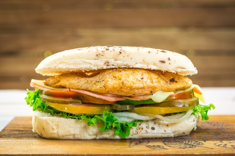 Grilled chicken sandwich with house sauce and fresh toppings
